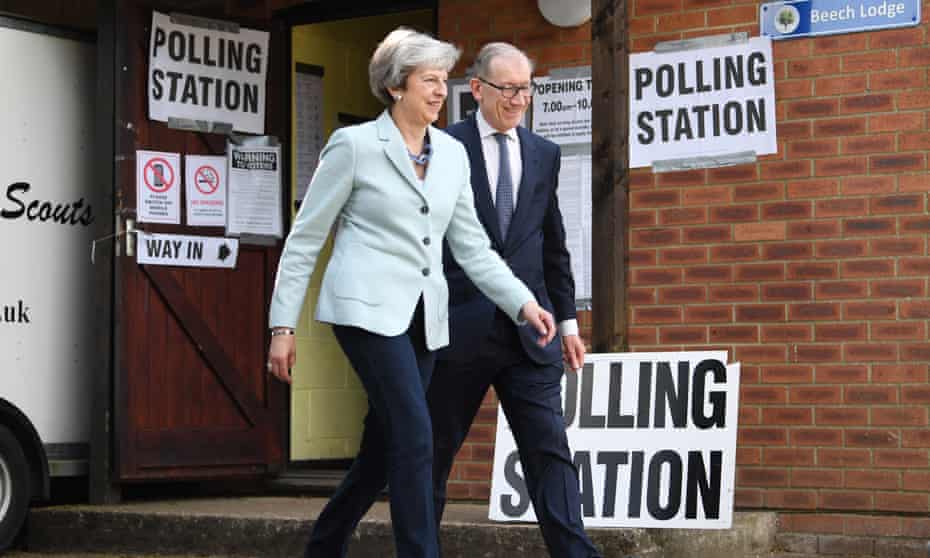 ritain’s Prime Minster Theresa May (L) and her husband Phillip (R) cast their vote at a polling station during the European elections in her Maidenhead constituency in Britain, 23 May