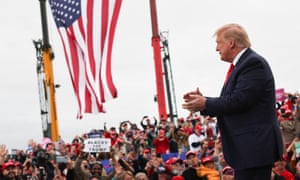 Donald Trump told a campaign rally in Michigan that America would prevail over coronavirus, as the country’s deaths neared 200,000.