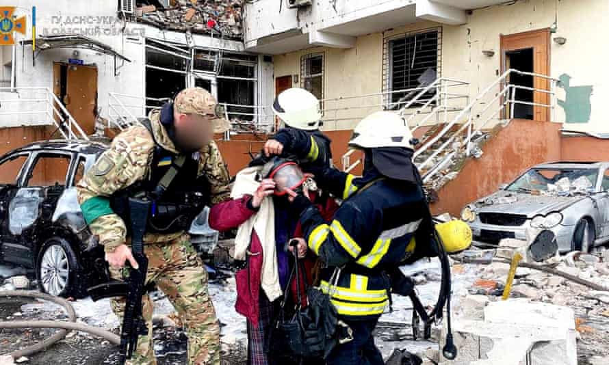 Emergency service workers rescue people after a missile strike, as Russia’s invasion of Ukraine continues, in Odesa Oblast.