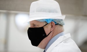 Boris Johnson wearing a face mask with “10” branding on it in Scotland last week.