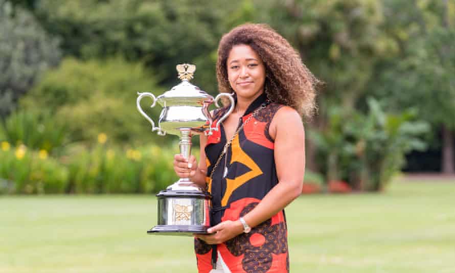 Naomi Osaka shows off the Australian Open trophy following her victory in Melbourne.
