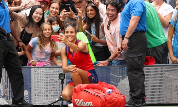 Emma Raducanu takes selfies with fans after her victory against Shelby Rogers at the US Open. 