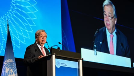 António Guterres, the UN secretary general, speaks at a podium to an audience.