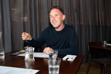 Oliver reacting to something Andrew’s said at a restaurant table