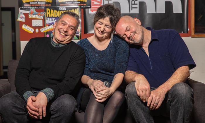 Christos Tsiolkas, Clem Bastow and Casey Bennetto sit on a couch at Triple R and smile at the camera