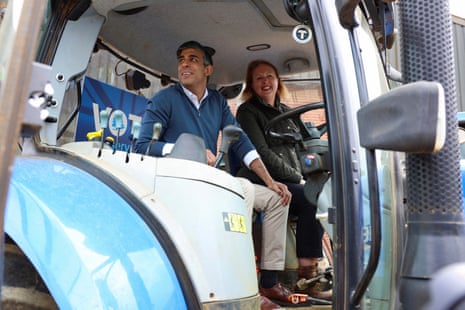 Rishi Sunak with Victoria Prentis, the attorney general and Tory candidate in Banbury, at Wykham Park farm earlier.