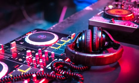 DJ music console in nightclub