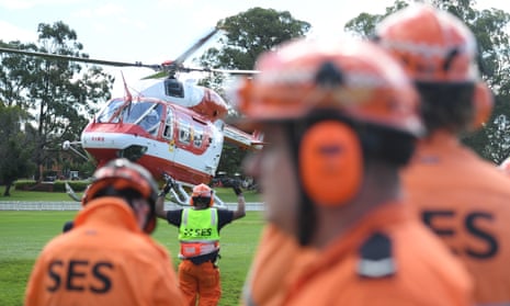 SES volunteers and a rescue helicopter