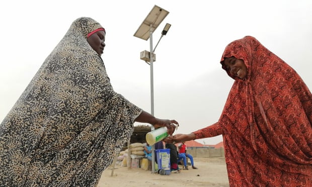 A woman dispenses soap at the Bakassi internally displaced people’s camp in north-east Nigeria.