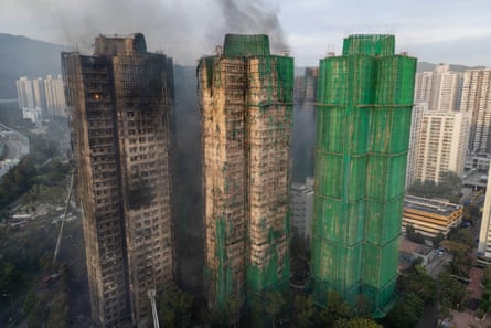 An aerial photograph showing the scaffolding and construction netting.