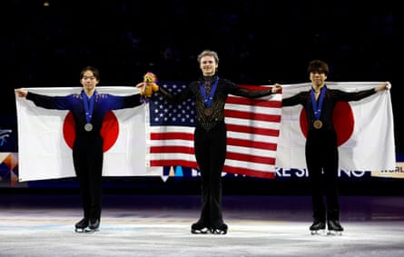 Gold medallist Ilia Malinin of the US celebrates during the medal ceremony with silver medallist Yuma Kagiyama and bronze medallist Shun Sato.