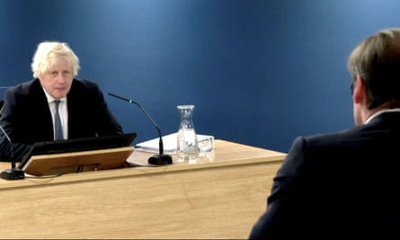 Boris Johnson seen in a screengrab seated at the inquiry, seen from over the shoulder of the person asking him questions
