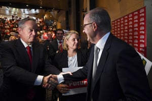 Anthony Albanese shakes hands with former Australian opposition leader Bill Shorten after delivering the speech.