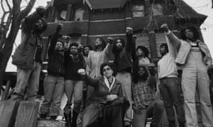 Members of move in front of their house in Philadelphia in 1977.