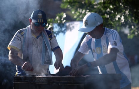 Argentina fans grill before a game.