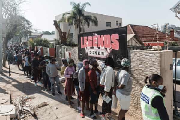 People queue for food and baby items distributed by Muslims For Humanity at Legends Diner, KwaZulu-Natal.