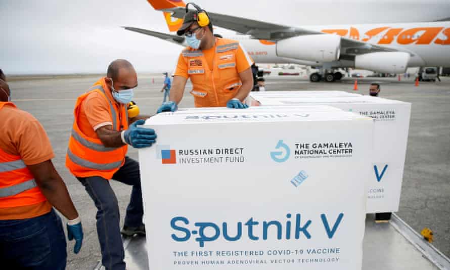 Workers handle a shipment of Russia’s Sputnik V vaccine in Caracas, Venezuela, in March.