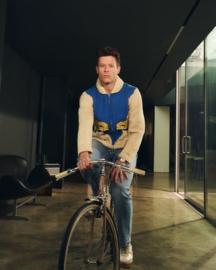 On his bike: James Norton wears cardigan by rokit.co.uk; jeans by everlane.com; trainers by grenson.com and watch by rolex.com.