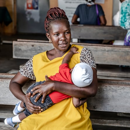 Annah Kadhengi holds her son Brighton Ushindi Baraka, who recovered from malaria, in the mother and child ward.