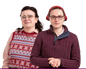 A composite of two white women with glasses and dark hair, one with colourful knitwear, the other clasping her hands together