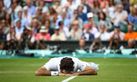 Roger Federer lies face down on the floor after of a slip during his semi-final defeat.