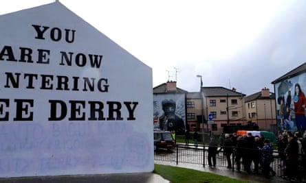 The funeral parade makes its way though the nationalist Bogside area of Derry.