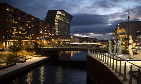 The Munch Museum illuminated at dusk in Oslo, Norway.