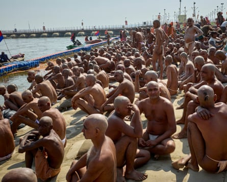 An initiation ceremony for new sadhus at Maha Kumbh Mela in Uttar Pradesh, India