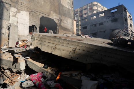 Palestinians inspect a house destroyed in an Israeli strike in Khan Younis.