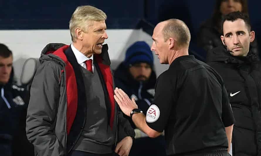 Mike Dean says his most stubborn antagonist was Arsenal's manager Arsène Wenger, left.
