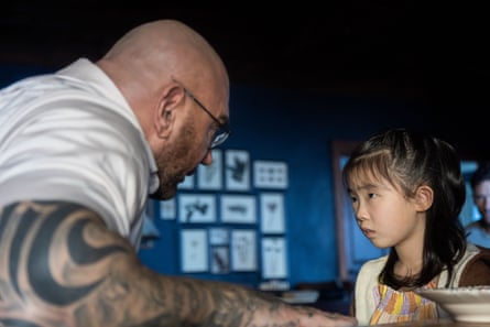 Dave Bautista and Kristen Cui in M Night Shyamalan’s chiller Knock at the Cabin.