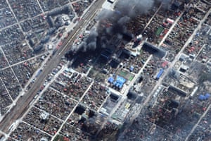 A satellite image shows damages and burning buildings in Irpin, near Kyiv, Ukraine, 21 March