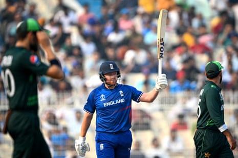 England's Jonny Bairstow (centre) raises his bat as he celebrates scoring a half-century against Pakistan.