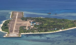 A military handout photo of Thitu island in 2015. Locally known as Pag-asa, meaning ‘hope’ in Filipino, Thitu is a tree-studded settlement no more than a mile long and less than half a mile wide. A dilapidated runway takes up almost half the area.