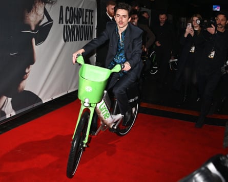 Anything for a bit of attention … Timothée Chalamet rides a bike.