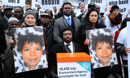 Westwood and Lawler hold two large pictures of Zane, as Gbangbola, who is in a wheelchair holds a box containing a petition calling for the Environment Agency to ‘investigate the truth’