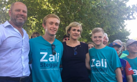 Zali Steggall with her husband Tim Irving and sons Rex Cameron (L) and Rent Cameron (R) on Sunday. Steggall is one of three female candidates standing against Tony Abbott in Warringah. 