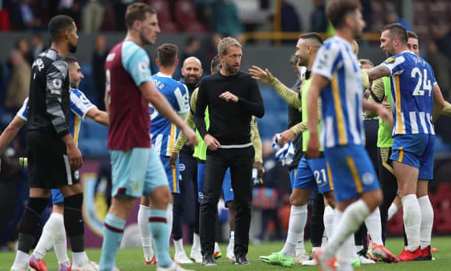 Graham Potter celebrates with his players after Brighton’s win at Burnley