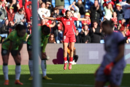 Mared Griffiths celebrates scoring a extremity for Wales.