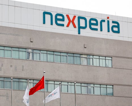 Flags fly next to a logo of Nexperia