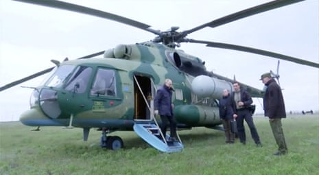 In this still image taken from a handout video from the Kremlin Russian President Vladimir Putin disembarks a helicopter as he visits the headquarters of the “Dnieper” army group in the occupied Kherson Region.