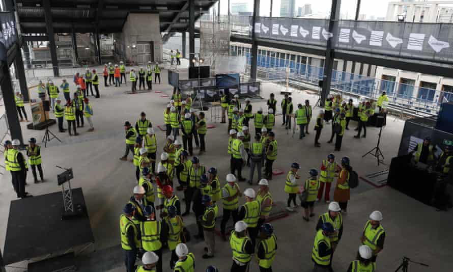 A single continuous suspended staircase runs from the ground floor to the top of the building, which the company says is designed to encourage interaction between staff.