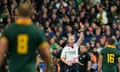 Referee Wayne Barnes holds up a red card during the Rugby World Cup final between New Zealand and South Africa