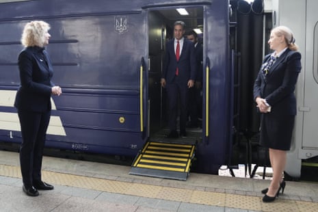 Ed Miliband stepping off a train.