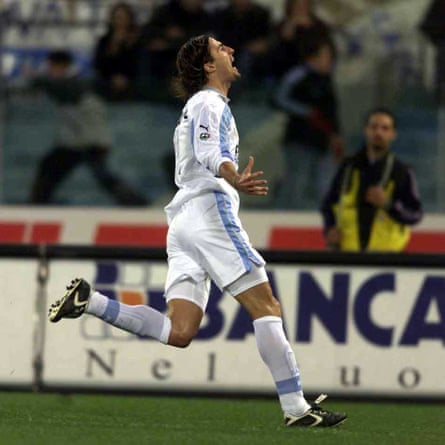 Baggio celebrates after scoring against Milan at the Stadio Olimpico