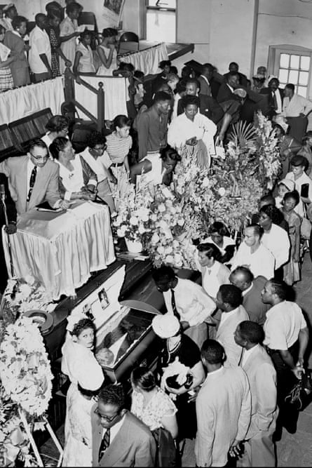 In this Sept. 3, 1955, file photo, mourners pass Emmett Till’s casket in Chicago. Till was a 14-year-old African American boy who was kidnapped, tortured and lynched for whistling at a white woman in Mississippi by a white mob.