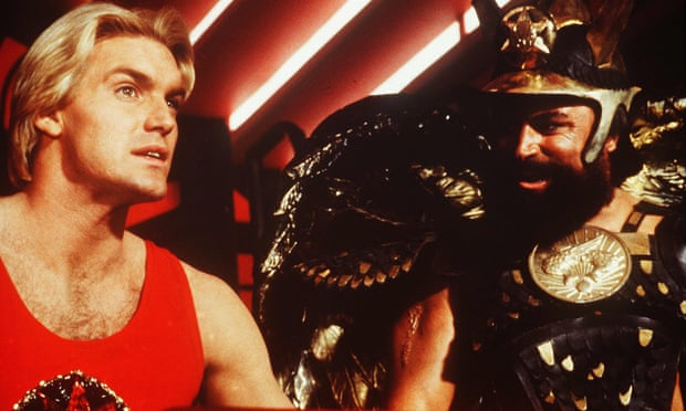‘He’s not supposed to be the sharpest knife in the drawer’ ... Sam J Jones as Flash, left, with Brian Blessed as Prince Vultan.
