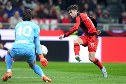 Christian Pulisic takes a shot during an AC Milan game.