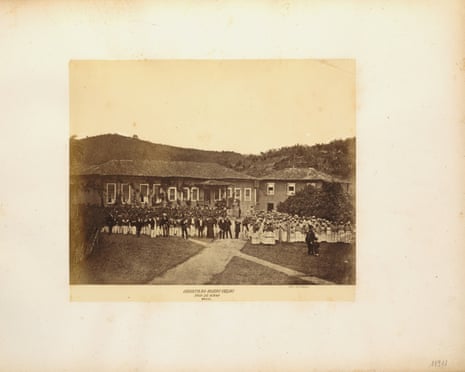 A black and white photograph of enslaved people owned by the British mining company St John d’El Rey