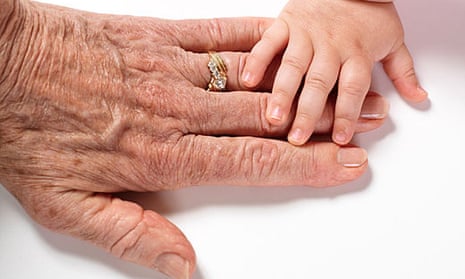 Baby's Hand Touching an older Woman's hand